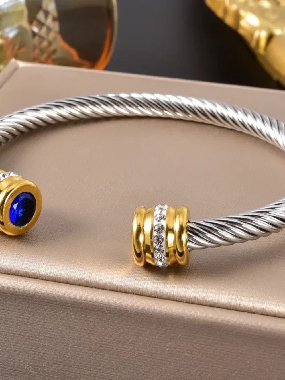 Two-Tone Cable Cuff Bracelet with Blue Gem Accent